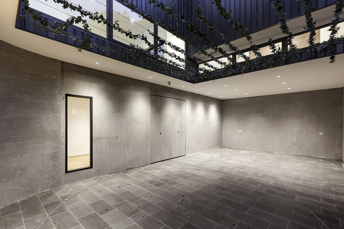 KUD Architects makes a strip window for the lounge area of South Yarra House in Australia