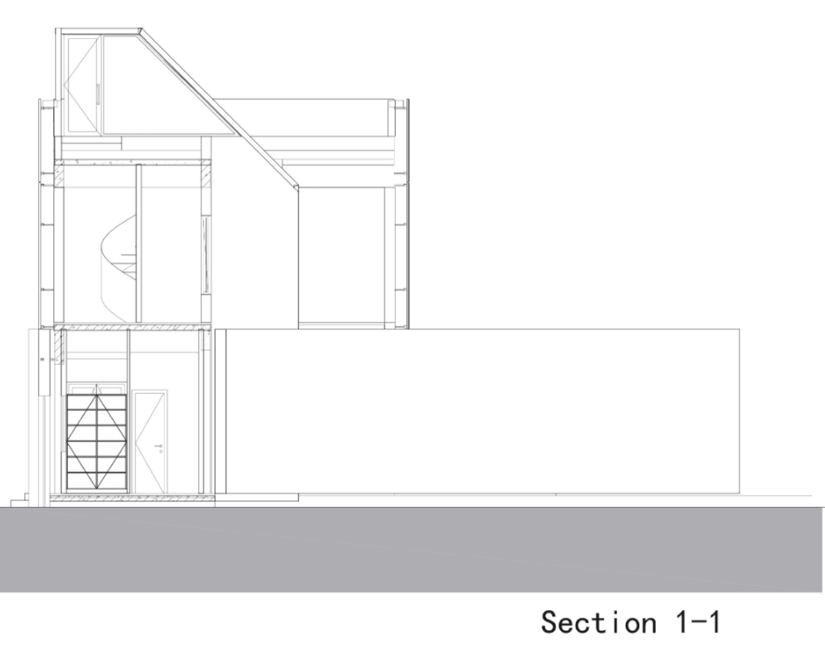 A red cedar grill placed on mottled worn walls of Ceramic House to preserve authenticity