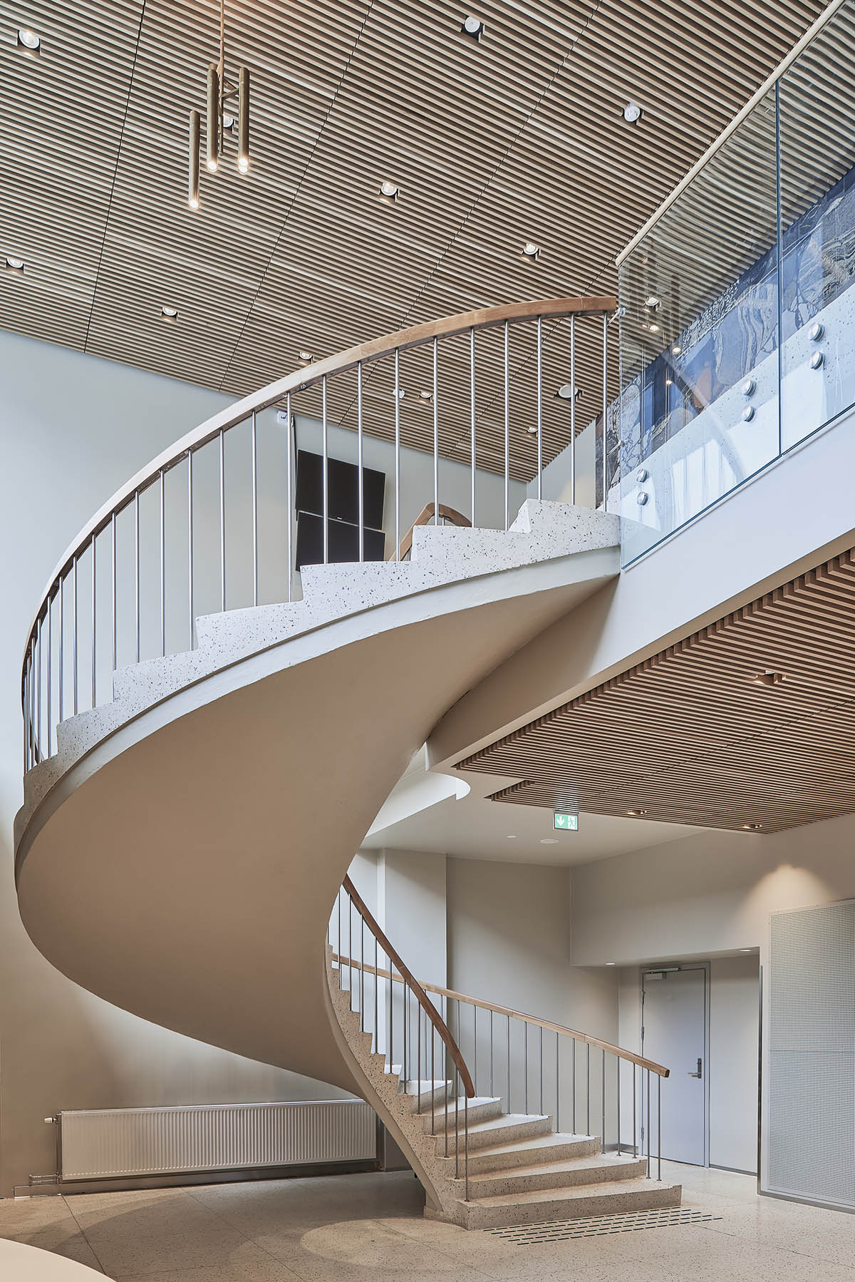 Snøhetta adds a rippling-stainless steel expansion to Lillehammer Art Museum and Lillehammer Cinema