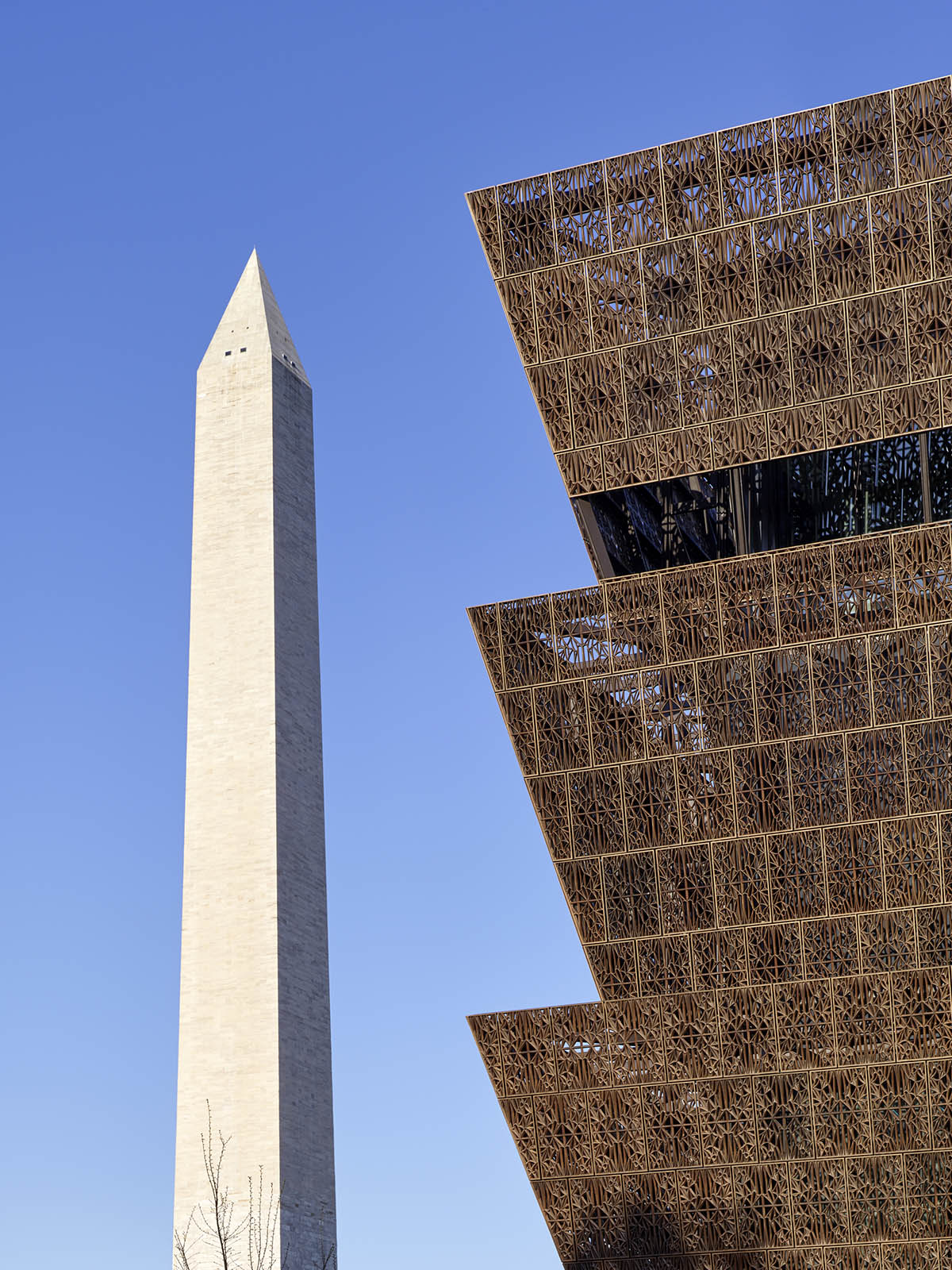 David Adjaye’s NMAAHC wrapped by ornamental bronze lattice opens next week in Washington
