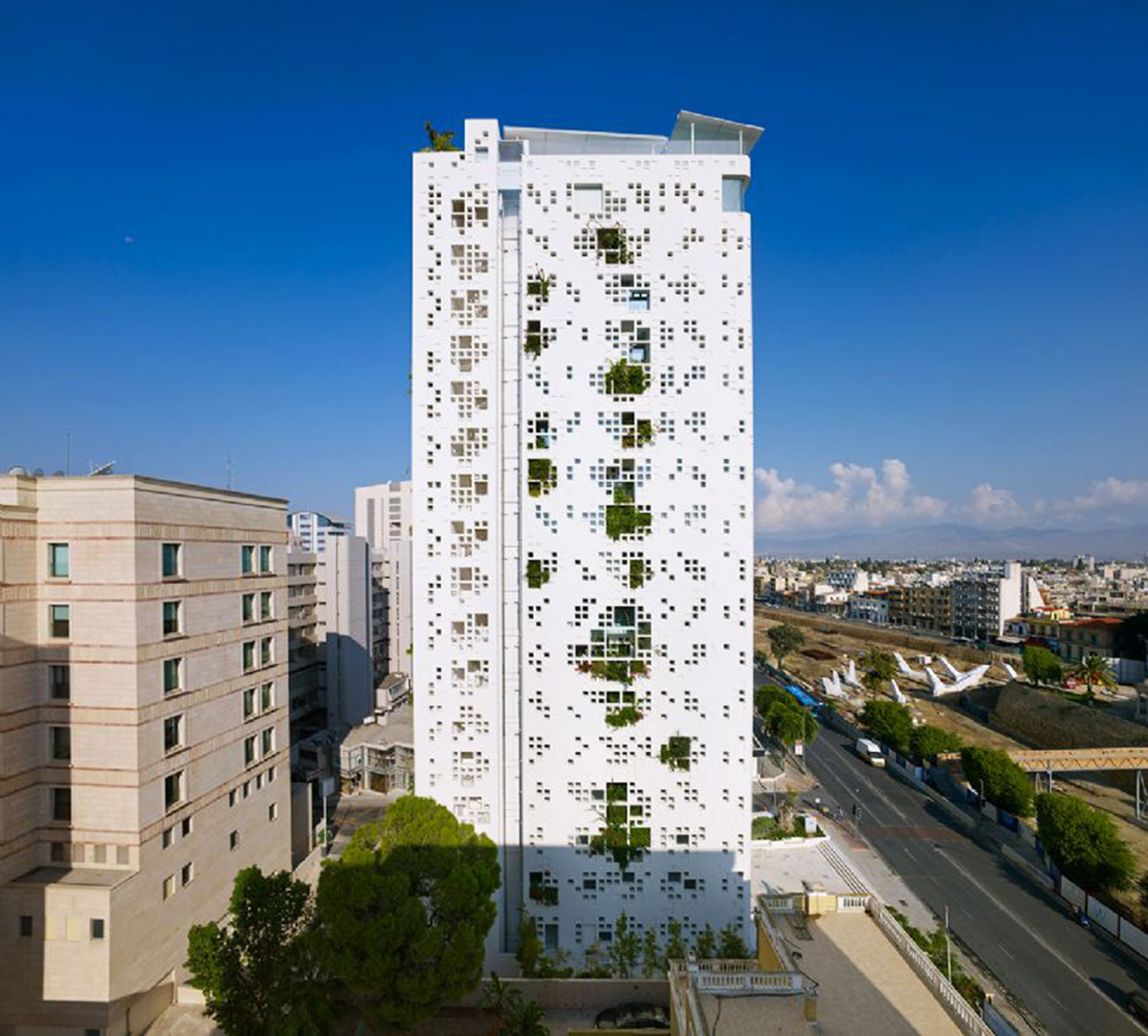 Jean Nouvel’s ’White Walls’ is a vertical landscape tower dominated by pixelated facade in Cyprus