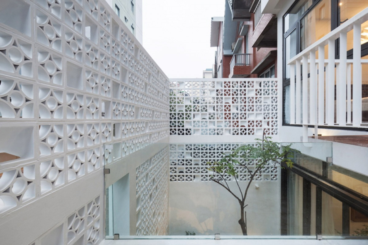 Landmark Architecture converts old brick residential unit into a cocoon house in Vietnam