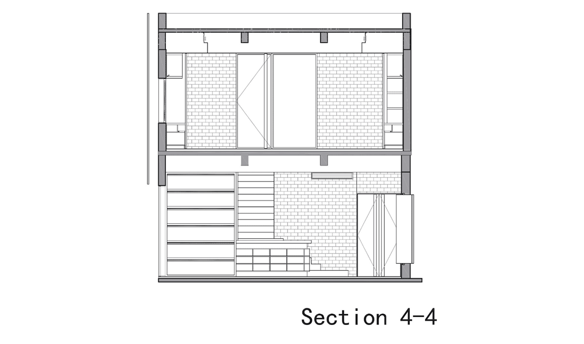 A red cedar grill placed on mottled worn walls of Ceramic House to preserve authenticity