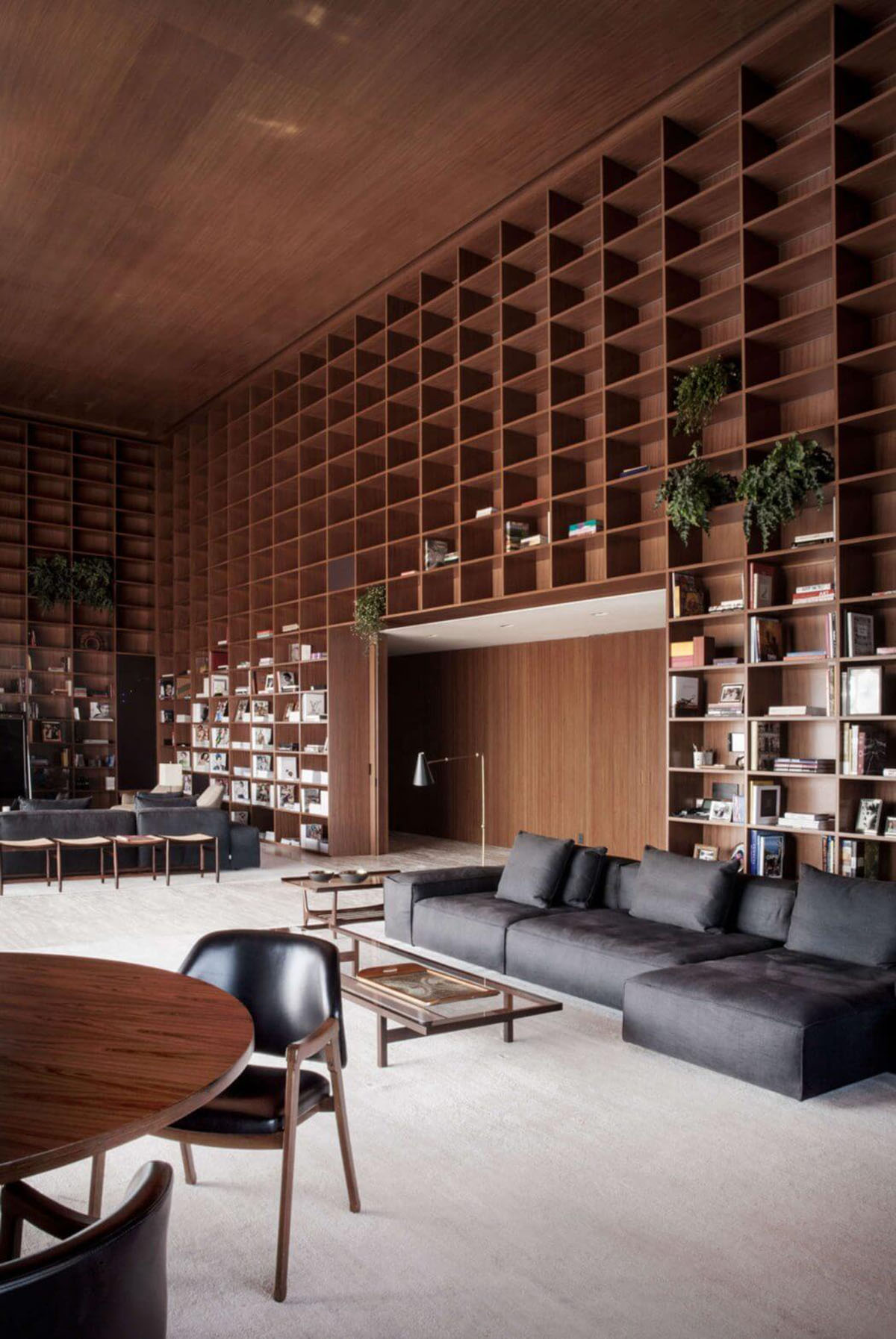 Studio MK27 sets up a reminiscent wooden library in Brazilian SP_Penthouse