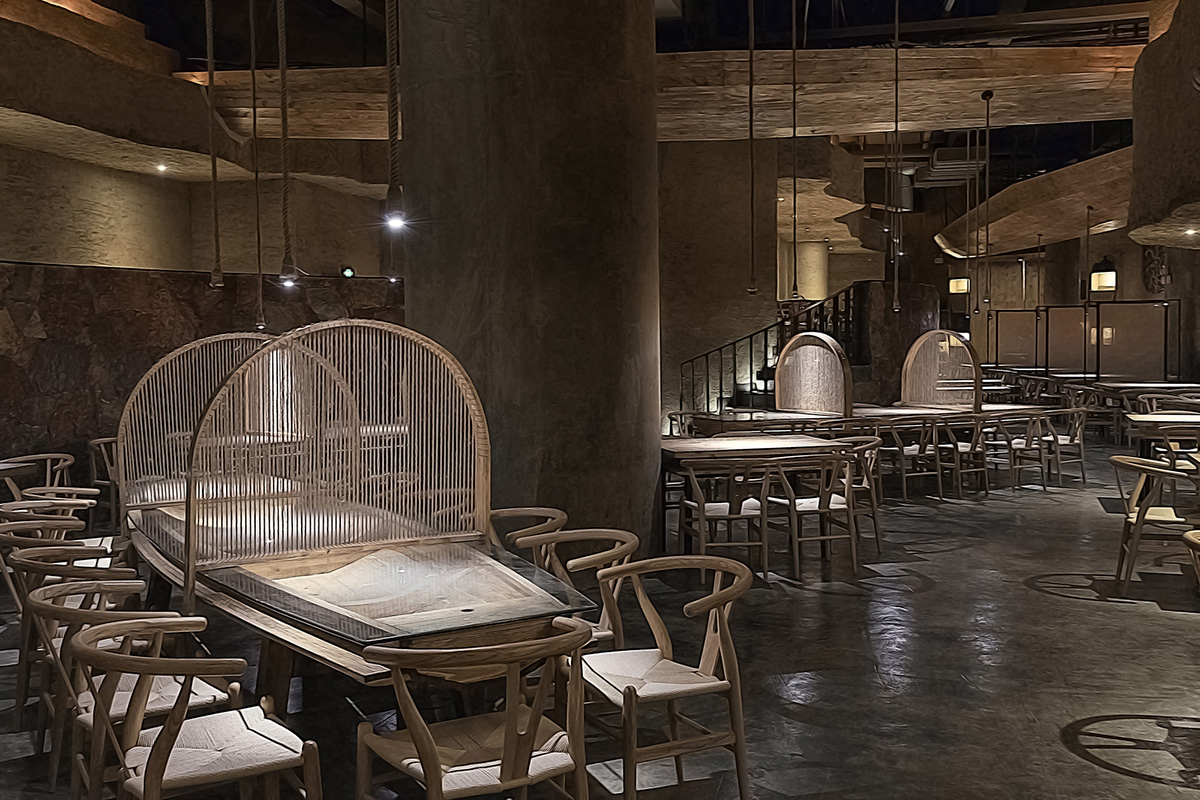 Designer Xu Xu-Jun hangs plenty of wooden-boats from the ceiling of Pu Zao Restaurant in China