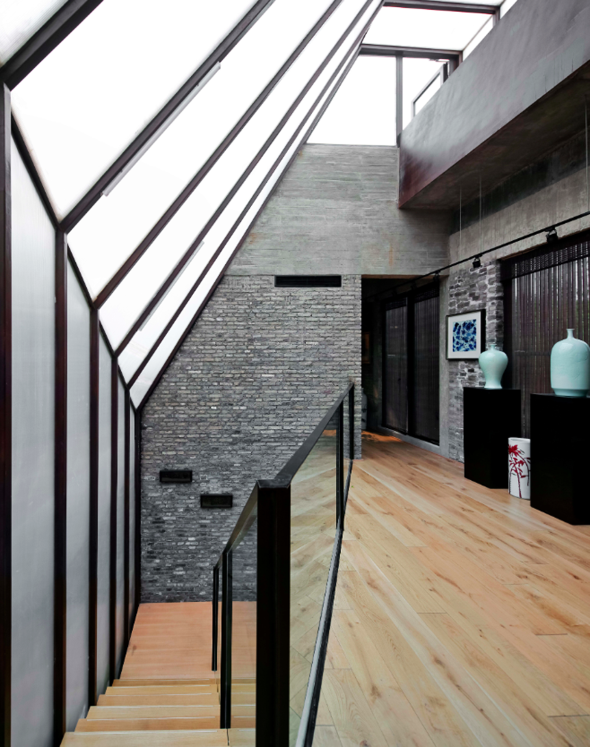 A red cedar grill placed on mottled worn walls of Ceramic House to preserve authenticity