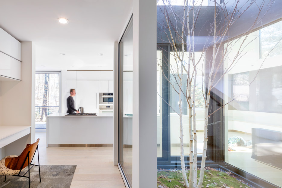 Merge Architects clads this family house with tree-trunk hue weathering steel panels in Lexington