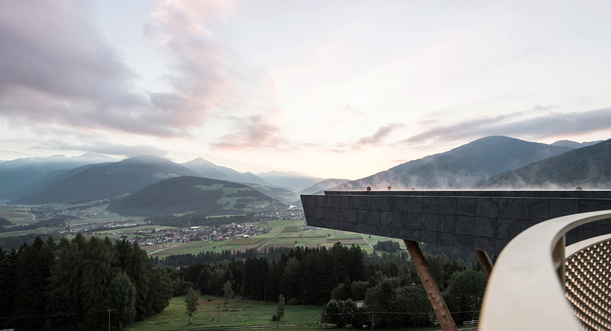 NOA’s Hubertus Hotel in Italy features cantilevering pool looking natural topography of the town