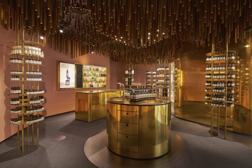 Snøhetta suspends ’a timber-forest’ from the ceiling of Aesop ION Store in Singapore