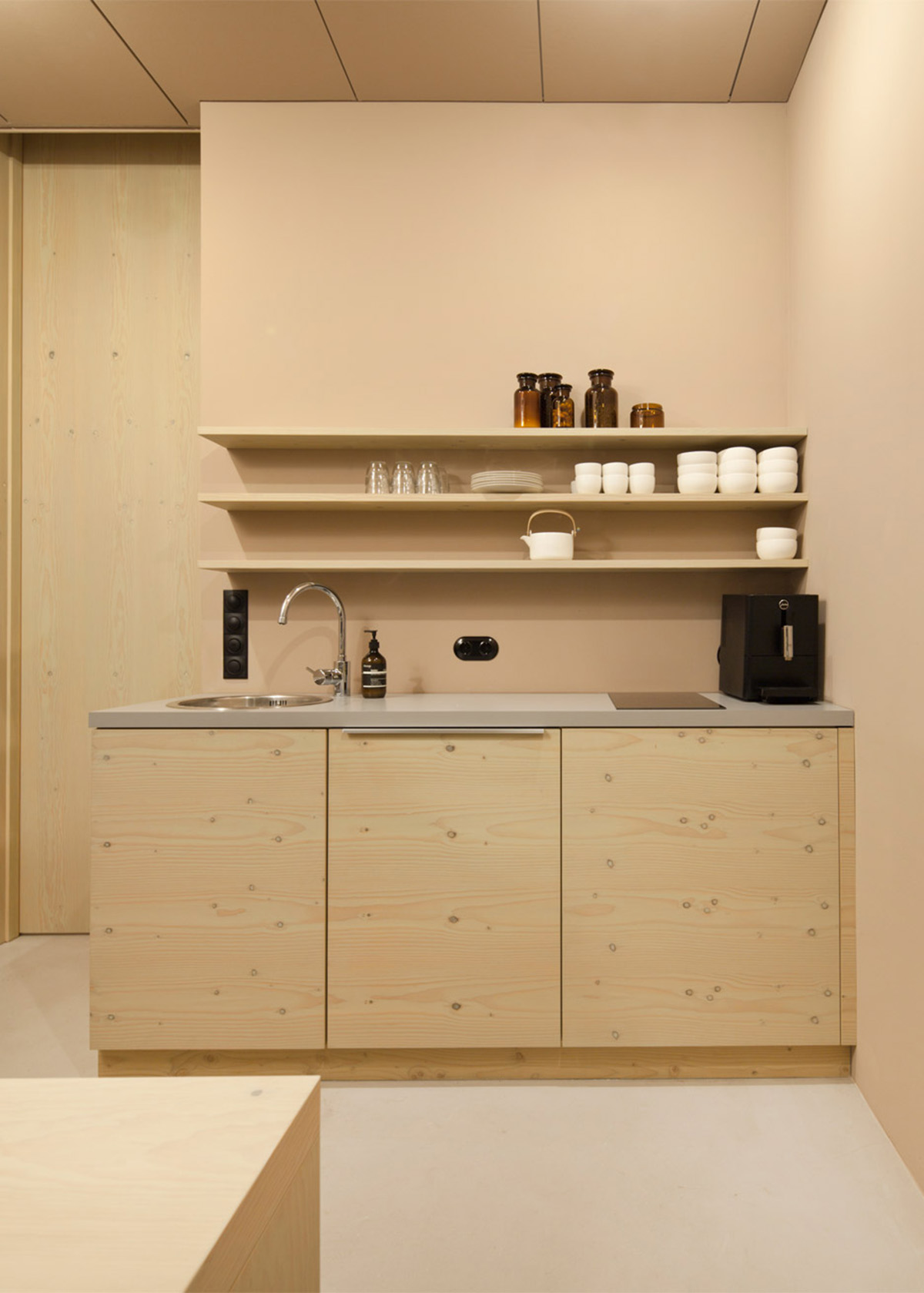 Snøhetta designed curvilinear wooden shelves with pastel colours for Aesop’s new Düsseldorf store