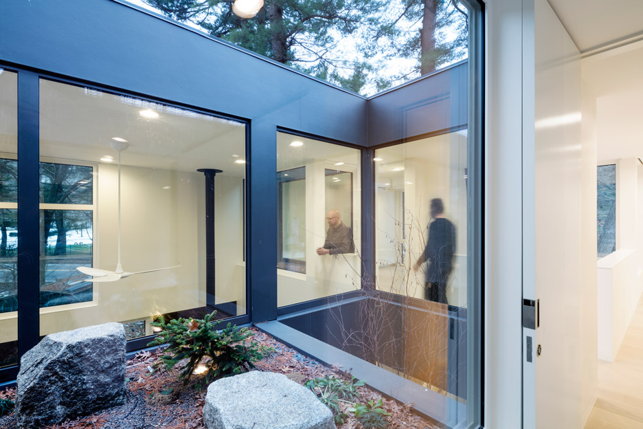 Merge Architects clads this family house with tree-trunk hue weathering steel panels in Lexington