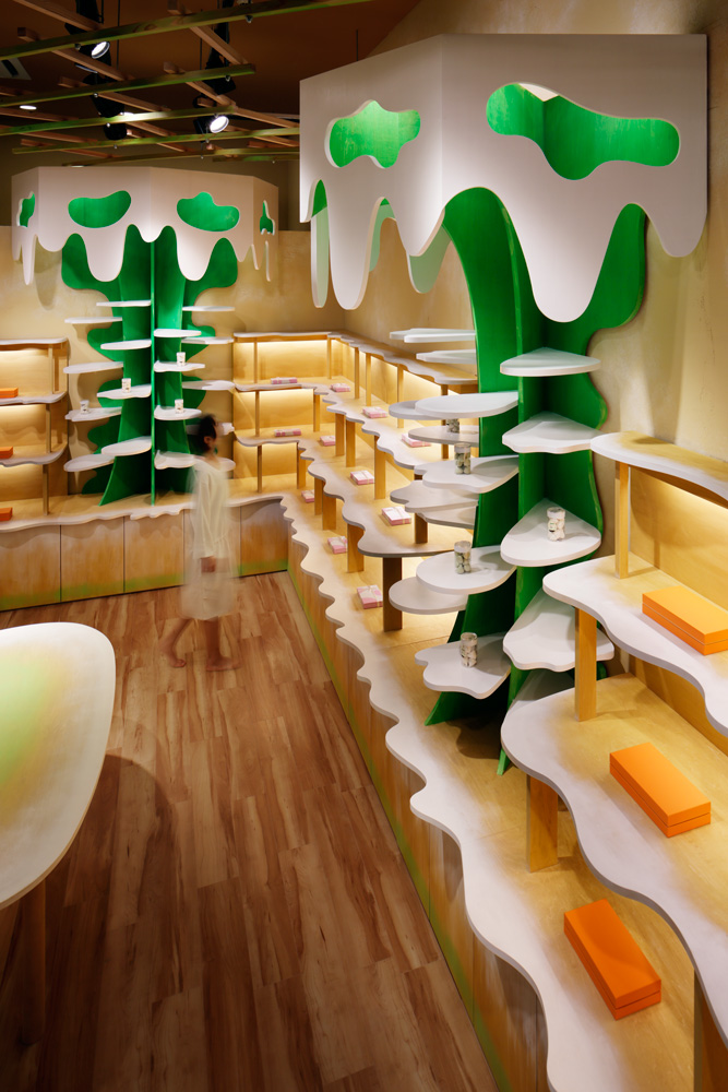 Moriyuki Ochiai Architects combines milky and forested tones with energetic patterns in MOMOM shop