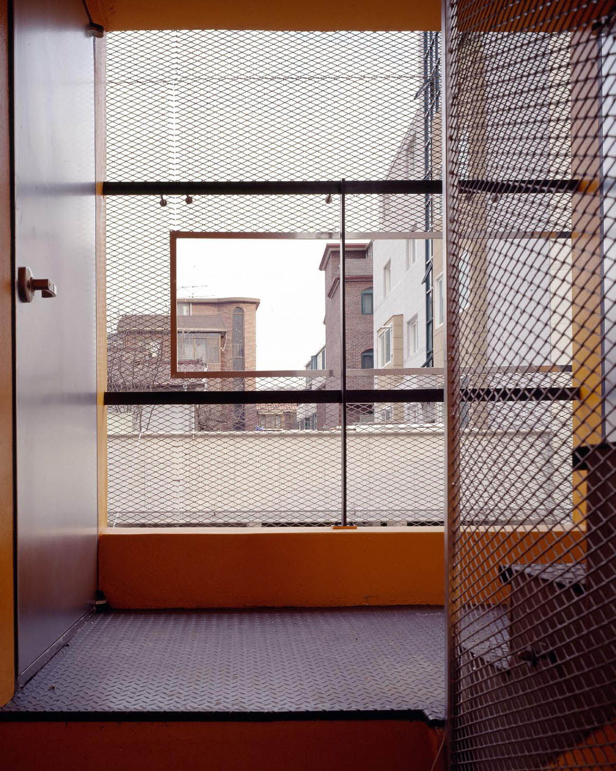 Moon Hoon clads Mookdong Multi House with expanded metal mesh inspired by panty-hose material