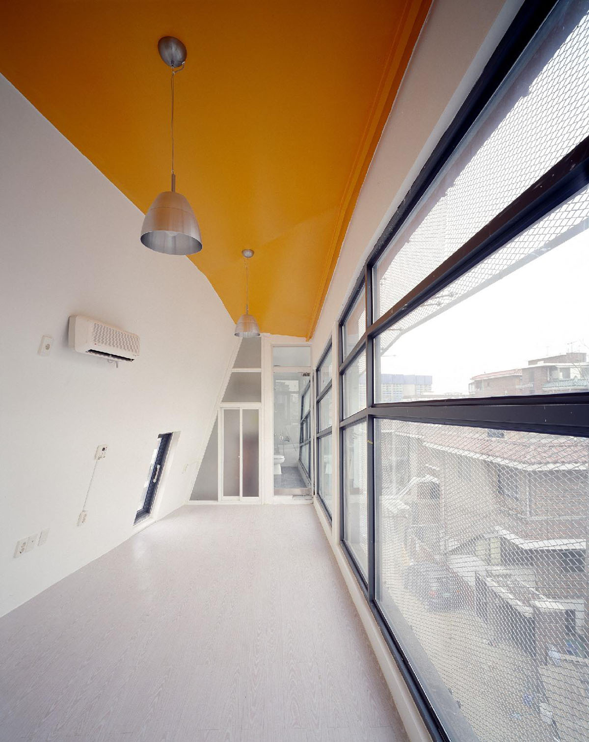 Moon Hoon clads Mookdong Multi House with expanded metal mesh inspired by panty-hose material