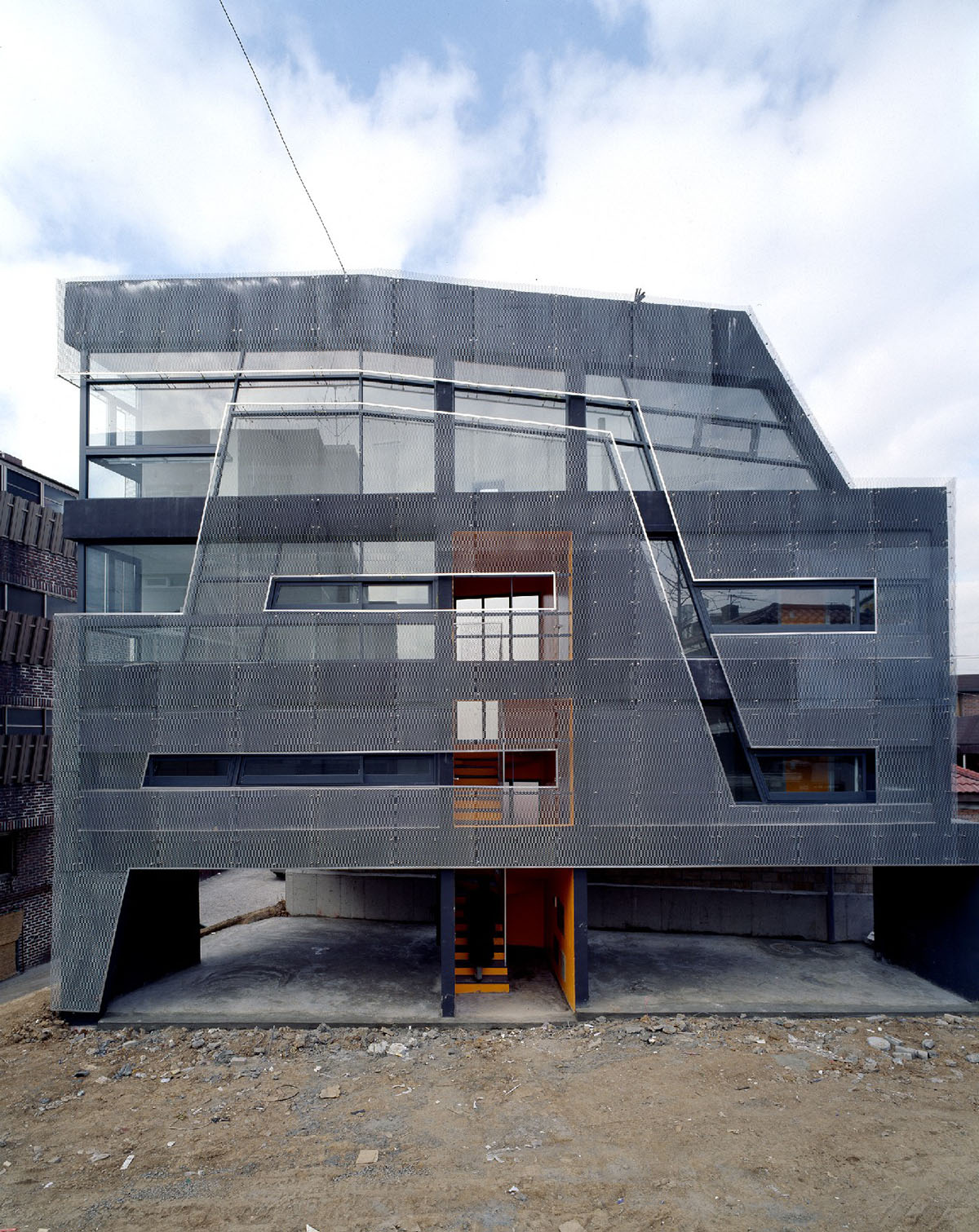 Moon Hoon clads Mookdong Multi House with expanded metal mesh inspired by panty-hose material