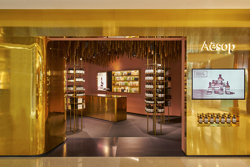 Snøhetta suspends ’a timber-forest’ from the ceiling of Aesop ION Store in Singapore