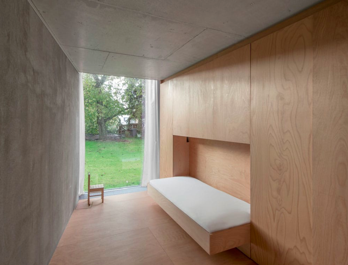 This branched tree-like house creates a chameleon effect in its surrounding