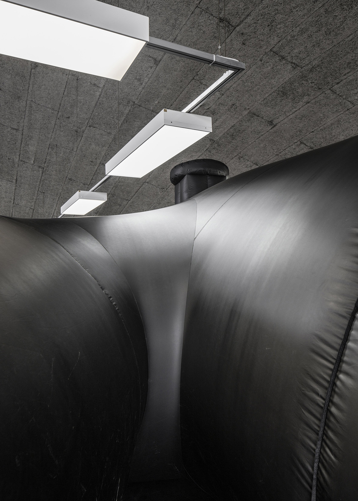 Bureau A designed an inflatable black shelter for a temporary nightclub made of PVC membrane
