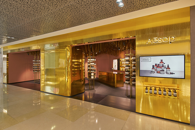 Snøhetta suspends ’a timber-forest’ from the ceiling of Aesop ION Store in Singapore