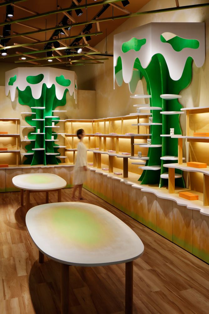 Moriyuki Ochiai Architects combines milky and forested tones with energetic patterns in MOMOM shop