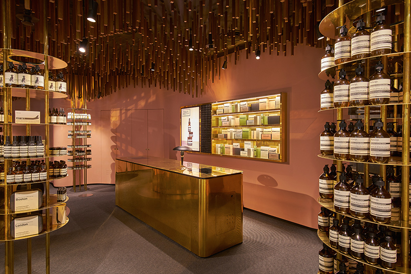Snøhetta suspends ’a timber-forest’ from the ceiling of Aesop ION Store in Singapore