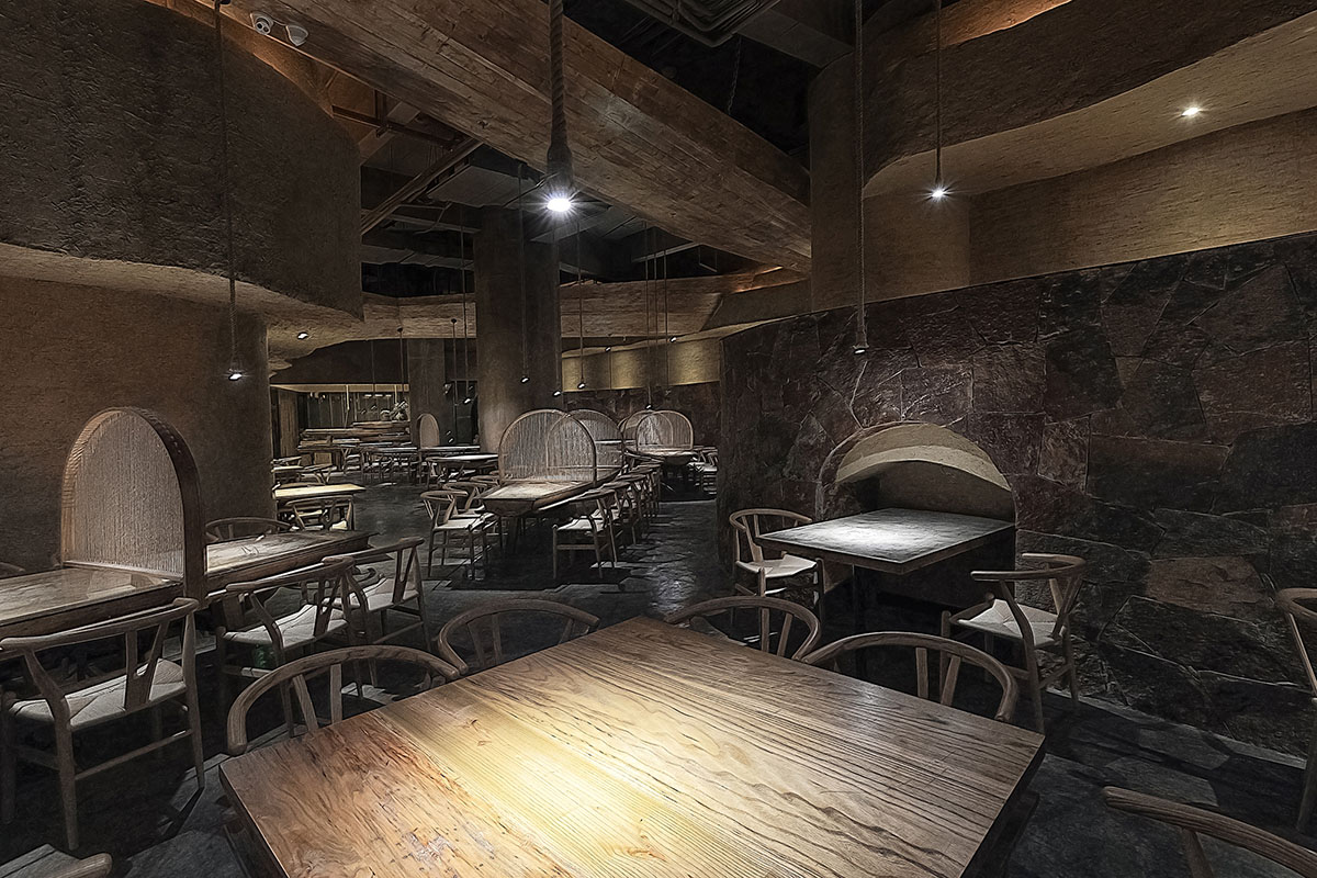 Designer Xu Xu-Jun hangs plenty of wooden-boats from the ceiling of Pu Zao Restaurant in China