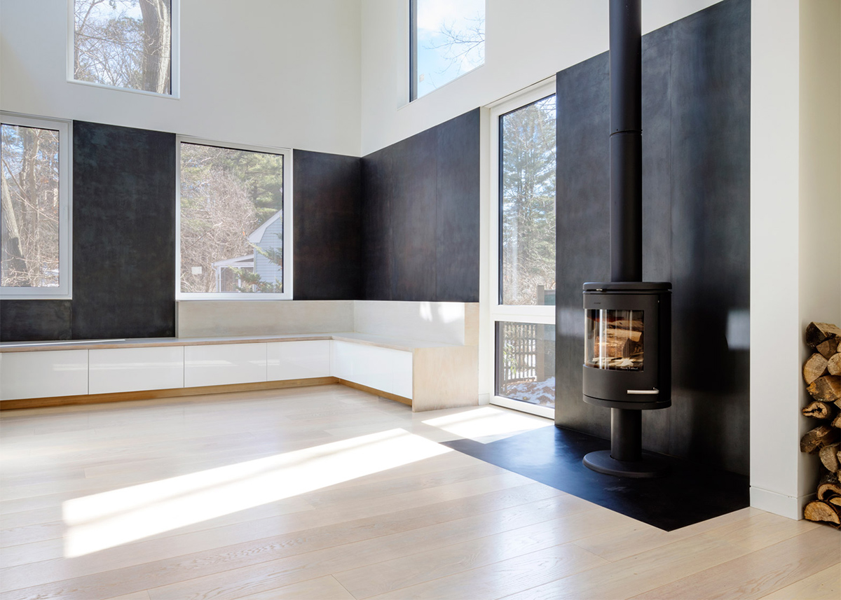 Merge Architects clads this family house with tree-trunk hue weathering steel panels in Lexington