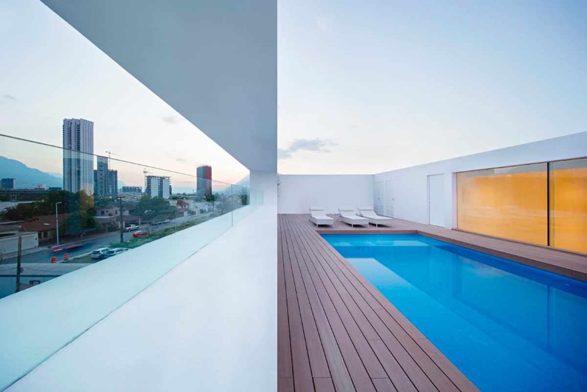 A nude-white house in Mexico filled with natural light and golden hue to create your dream house