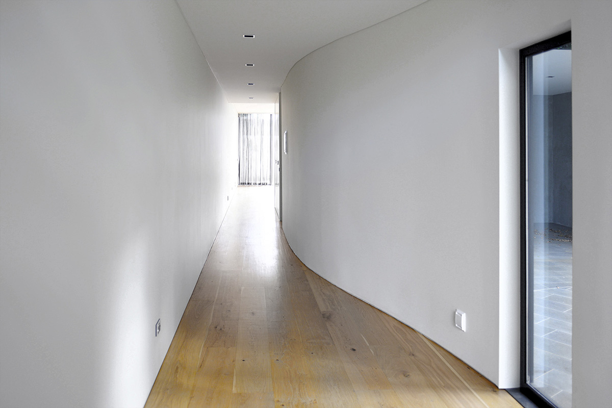 KUD Architects makes a strip window for the lounge area of South Yarra House in Australia