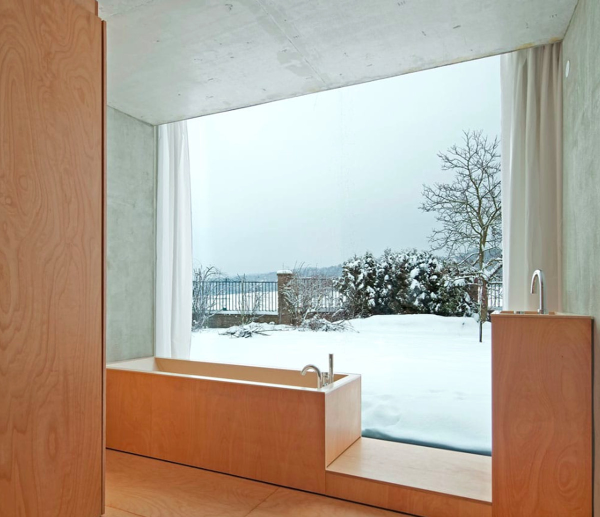 This branched tree-like house creates a chameleon effect in its surrounding