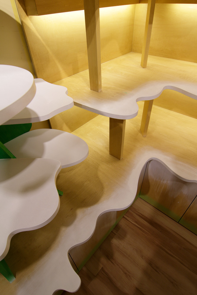 Moriyuki Ochiai Architects combines milky and forested tones with energetic patterns in MOMOM shop