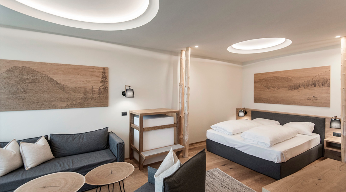 NOA’s Hubertus Hotel in Italy features cantilevering pool looking natural topography of the town