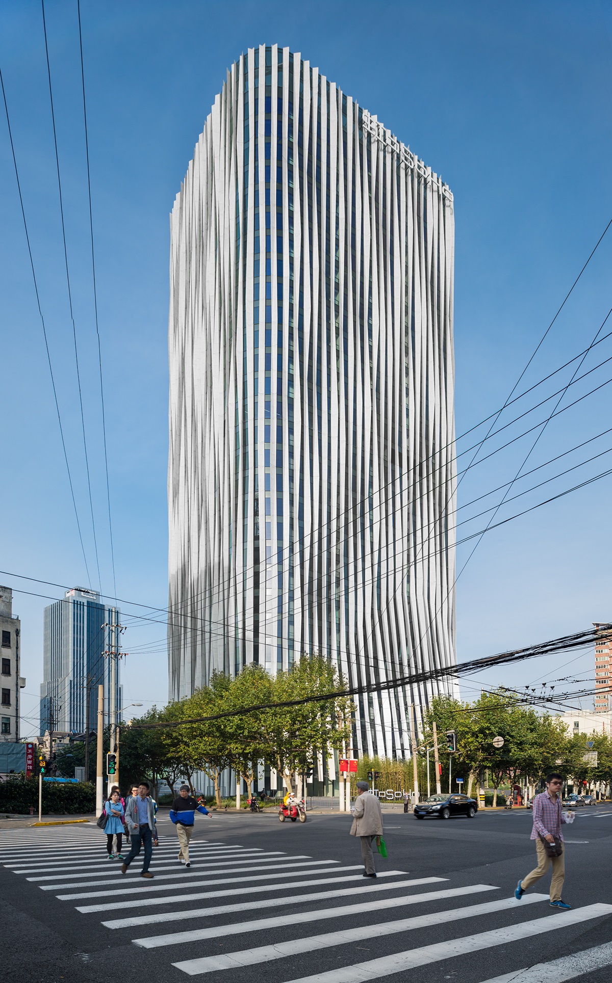 Kengo Kuma and Associates designed a Woven Lace-like office building Hongkou Soho in China