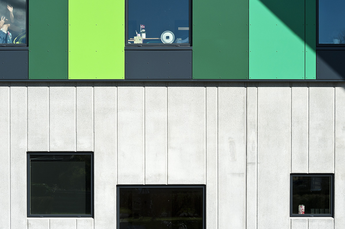 CEBRA’s Aabybro School interpreted by modern pitched roof and green strips opened in Denmark