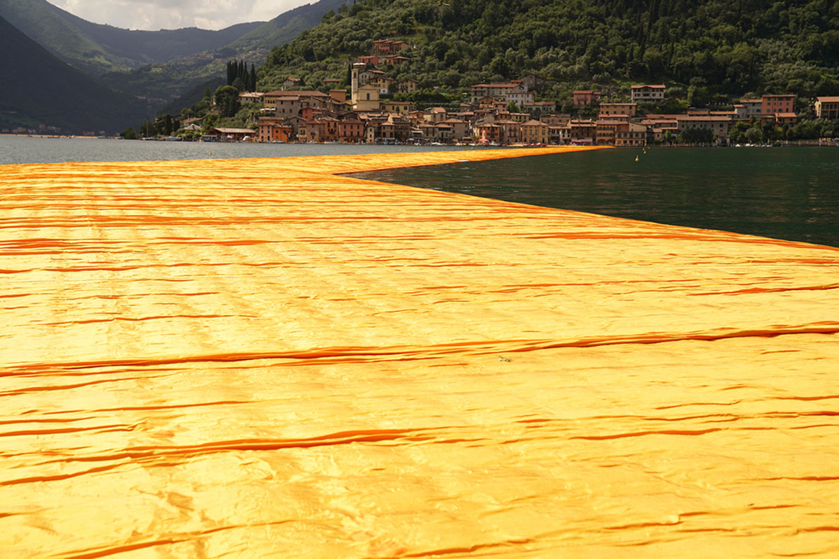Christo and Jeanne-Claude reimagine Italy&rsquo;s Lake Iseo with shimmering yellow fabric on the water