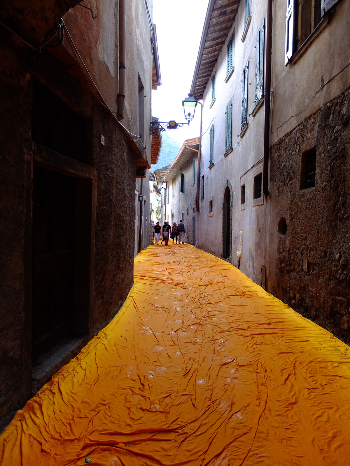 Christo and Jeanne-Claude reimagine Italy&rsquo;s Lake Iseo with shimmering yellow fabric on the water