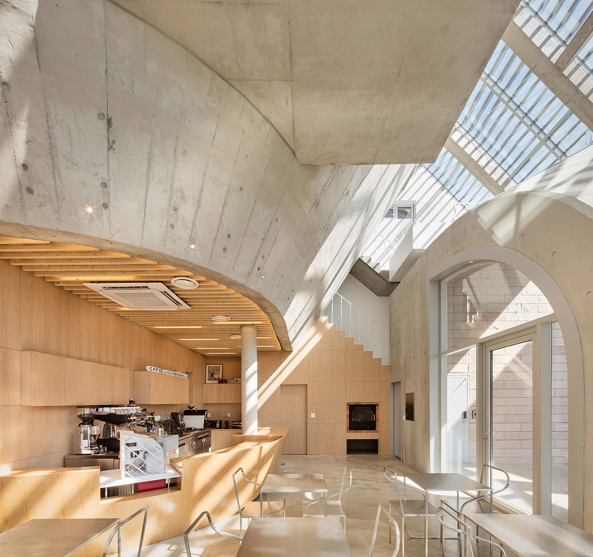 AND wraps a cafe/residence in South Korea with diagonal metal louvers