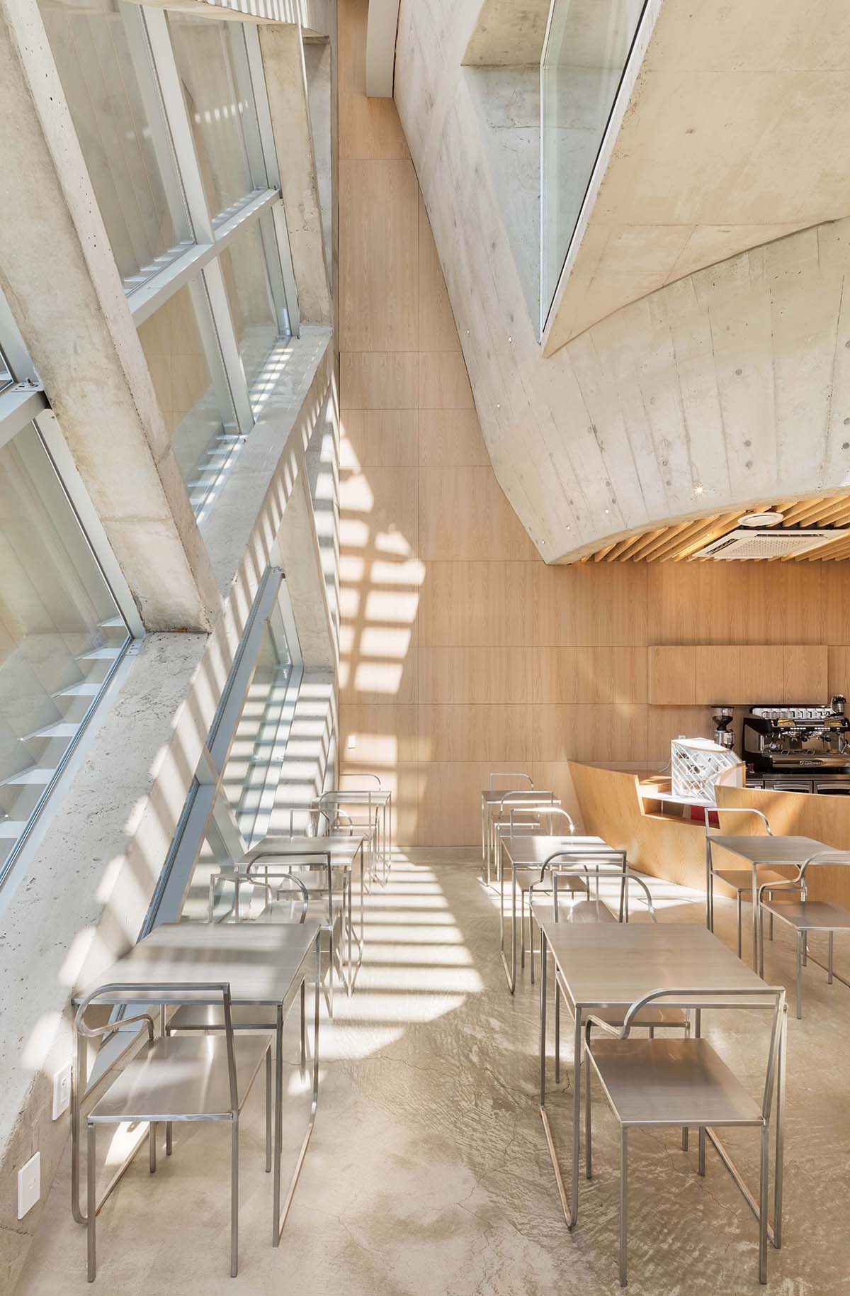 AND wraps a cafe/residence in South Korea with diagonal metal louvers