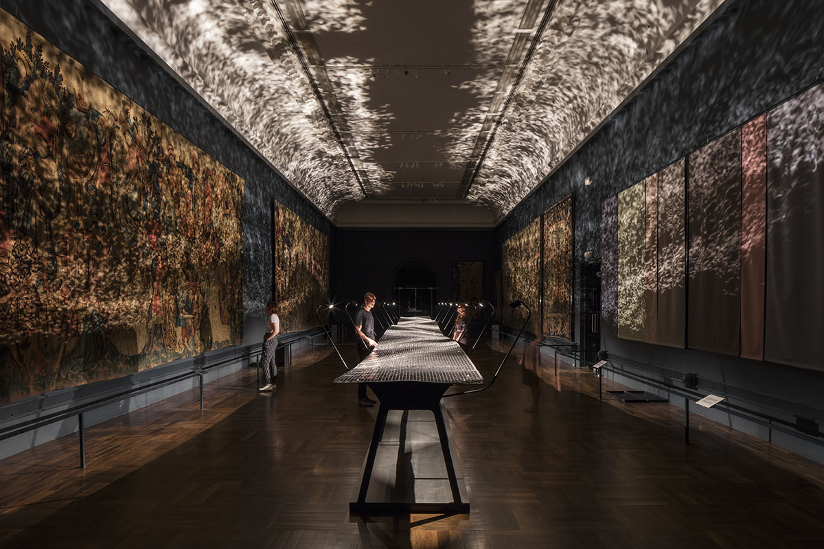 Benjamin Hubert+Braun set an immersive Foil morphing lights trilateral in the V&A&rsquo;s Tapestry gallery