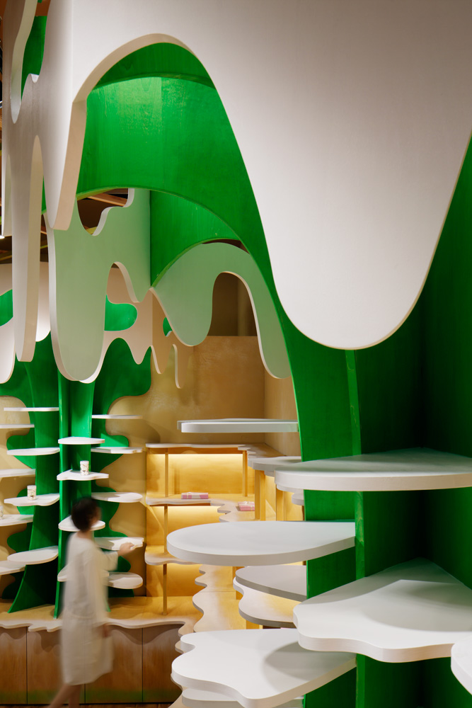 Moriyuki Ochiai Architects combines milky and forested tones with energetic patterns in MOMOM shop