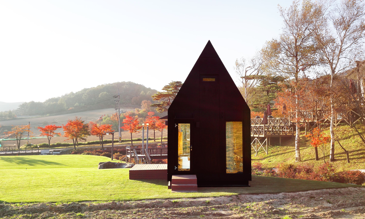 A Tiny House Of Slow Town by The Plus Partners+DNC Architects creates a minimum footprint