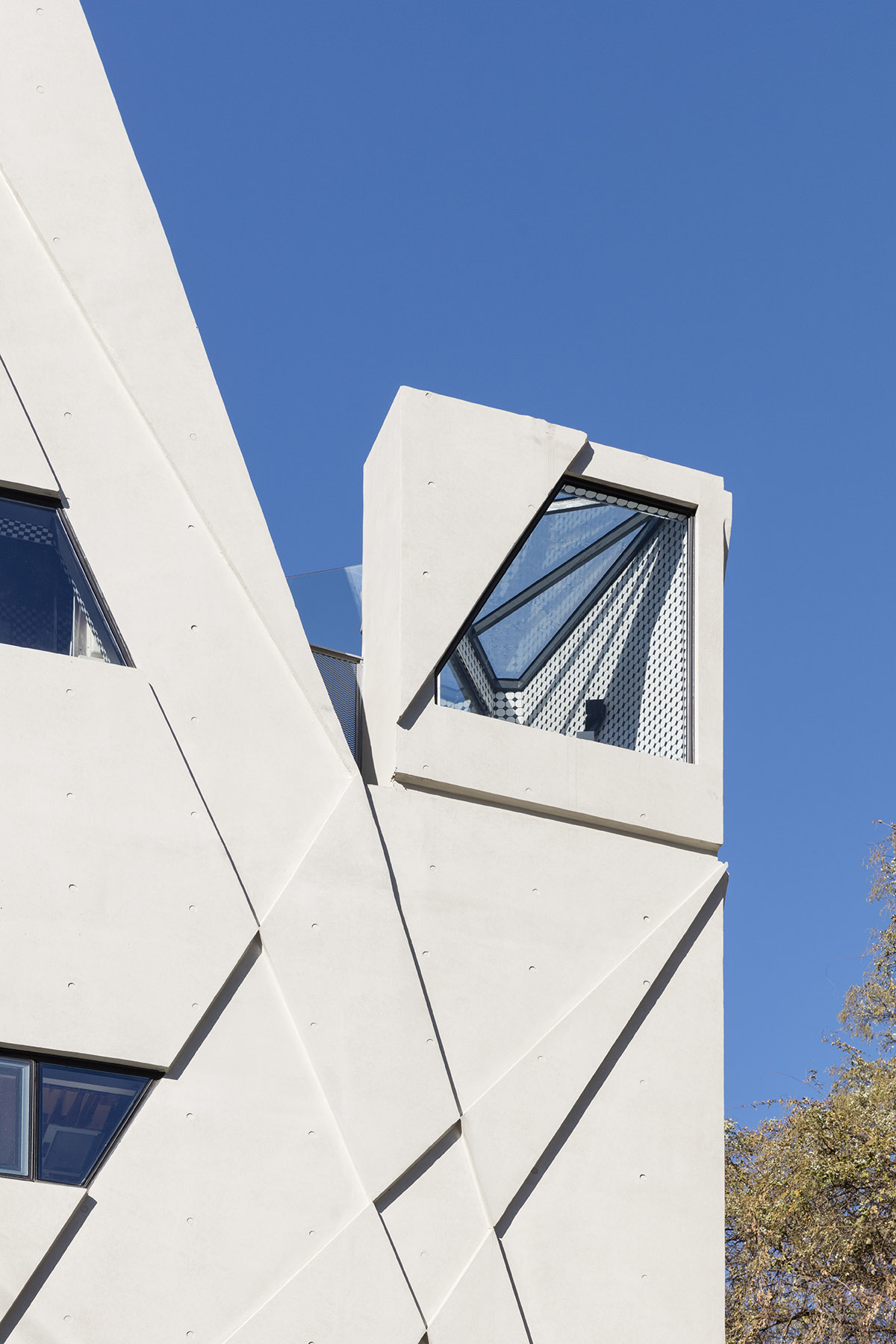 Moon Hoon completes Dogok Maximum mixed-use narrow house in Seoul with randomly drawn windows