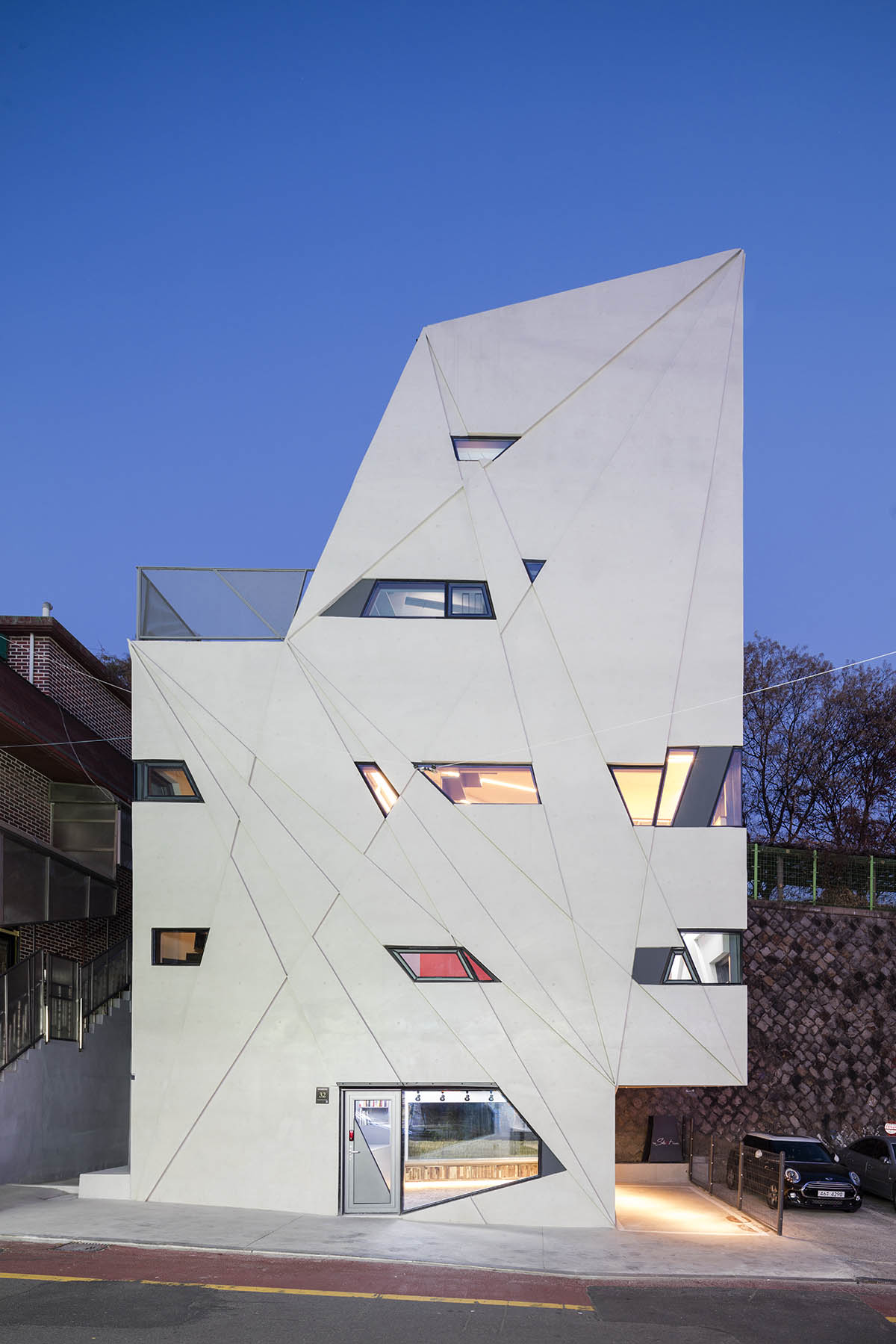 Moon Hoon completes Dogok Maximum mixed-use narrow house in Seoul with randomly drawn windows