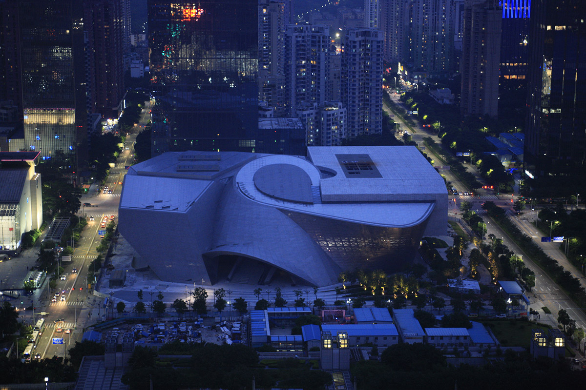 A silvery shining monolithic museum-MOCAPE by Coop Himmelb(l)au opened in Shenzhen