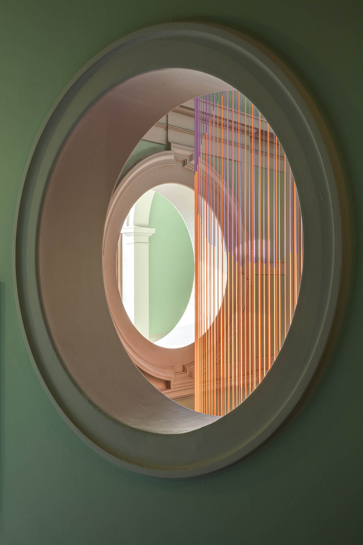 Glithero suspends an abstract version of clock at V&A made up of 160 multicoloured silicone cords