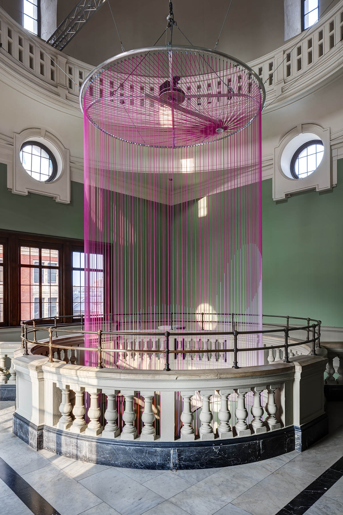 Glithero suspends an abstract version of clock at V&A made up of 160 multicoloured silicone cords