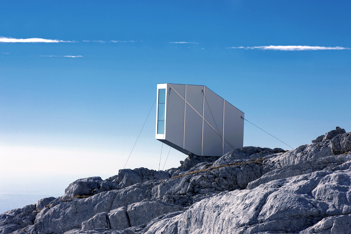 This Winter Cabin by OFIS Architects resists to gravity on Slovenia&rsquo;s rocky mountains