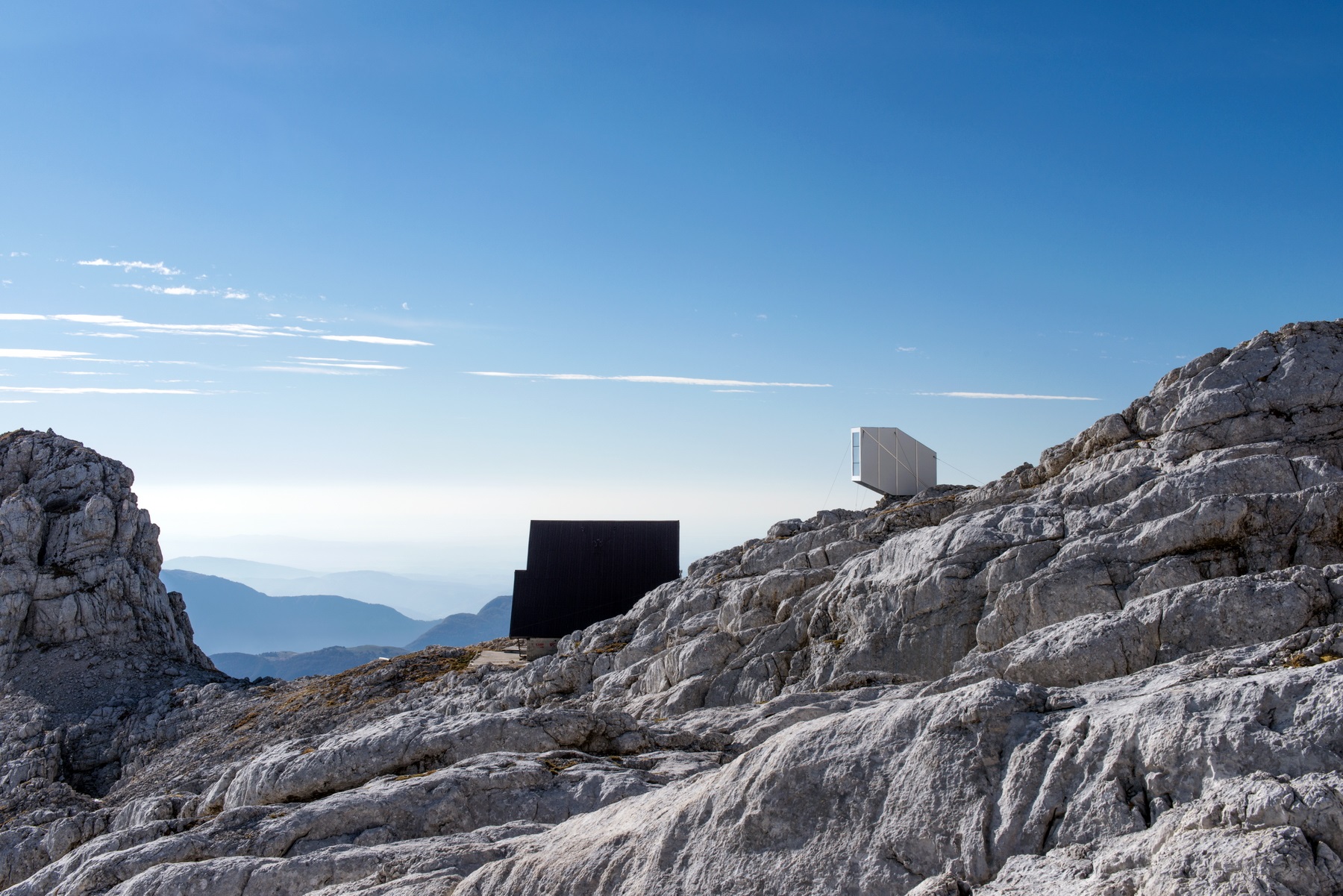 This Winter Cabin by OFIS Architects resists to gravity on Slovenia&rsquo;s rocky mountains