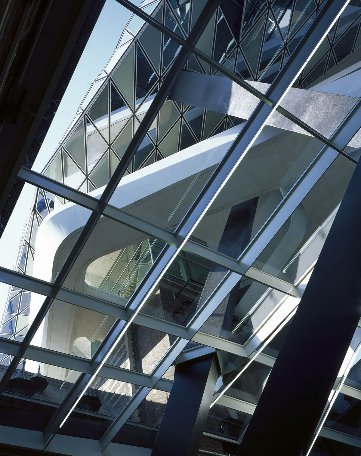 Zaha Hadid Architects crowns Belgium’s historic Antwerp Port Building with a floating glazed tower