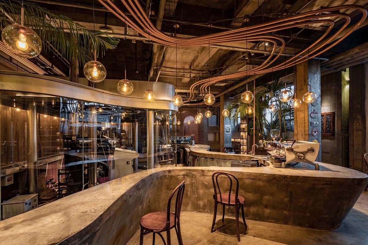 Linkchance Architects creates coffee store and art studio with golden metallic interiors in Beijing